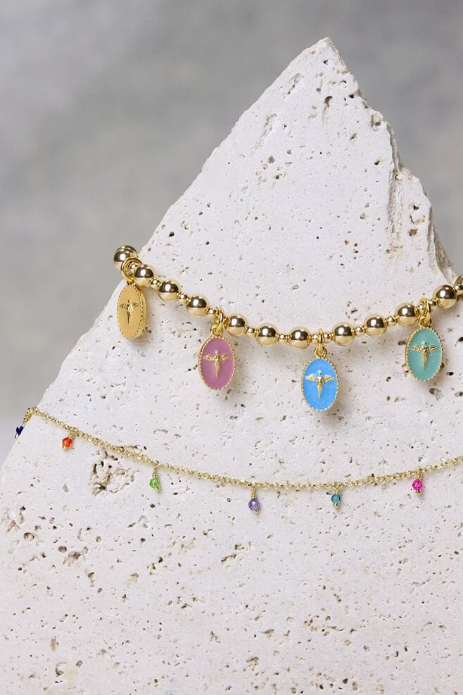 Embrace the divine with our Iridescent Angel Charm Bracelet – a true testament to eternal protection, crafted with Italian Enamel charms and gold-plated silver.