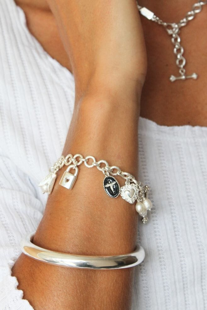 Ten beautiful, eye-catching charms dangle from an elegant 925 Sterling Silver chain bracelet.