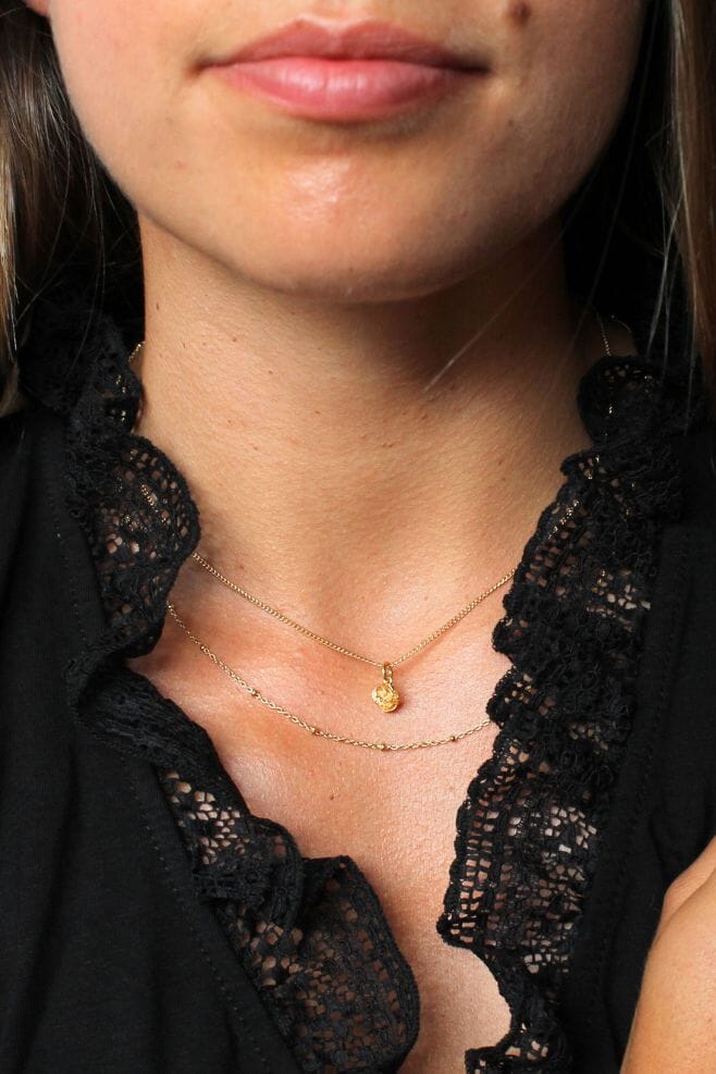Handcrafted in gold plated Silver, this simple necklace is dainty, yet eye-catching due to its unique chain design.