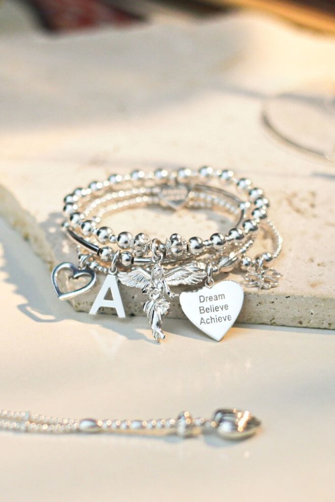 5 strand bracelet stack, featuring our iconic 925 Sterling Silver My Guardian Angel charm.