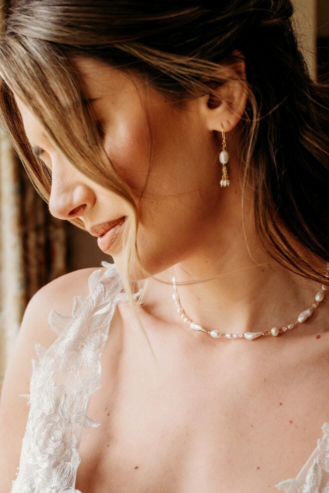 A modern and romantic pearl necklace, featuring an array of Baroque pearls, freshwater pearls, 18k gold plated Silver, and sparkling pink crystals.