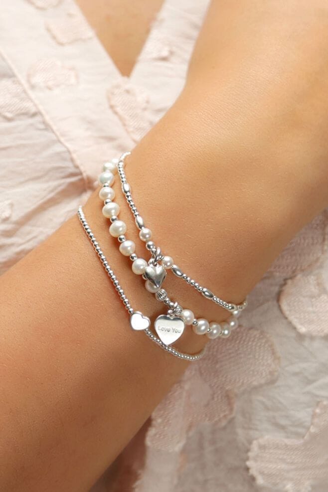 Three strand bracelet stack featuring Grade AA Freshwater Pearls and 925 Sterling Silver beads.