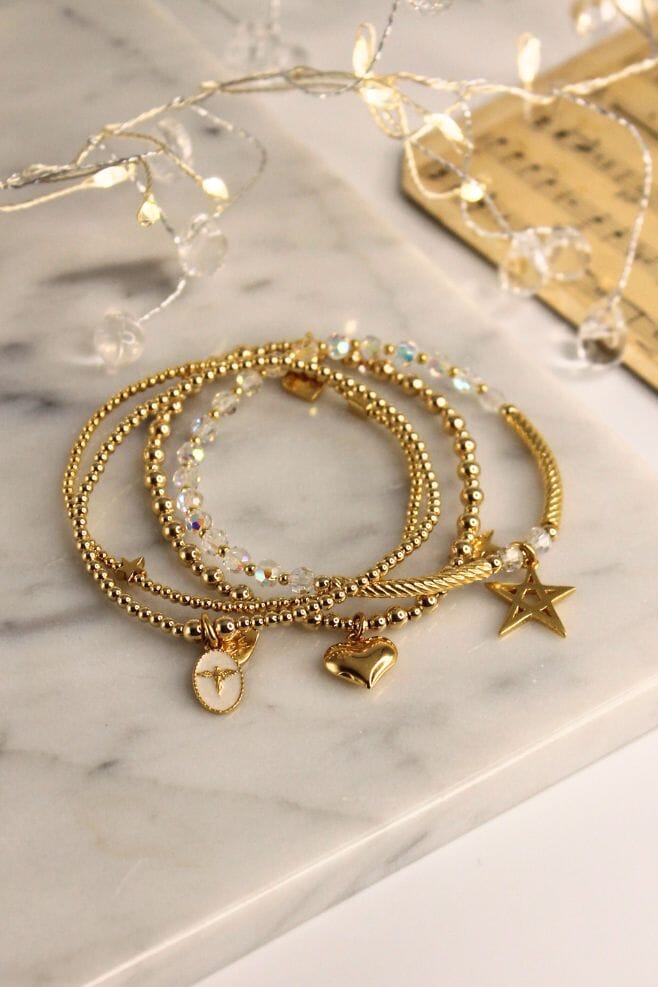 An enchanting four strand bracelet stack, featuring the new Silhouette Angel Charm and sparkling Preciosa Crystals.