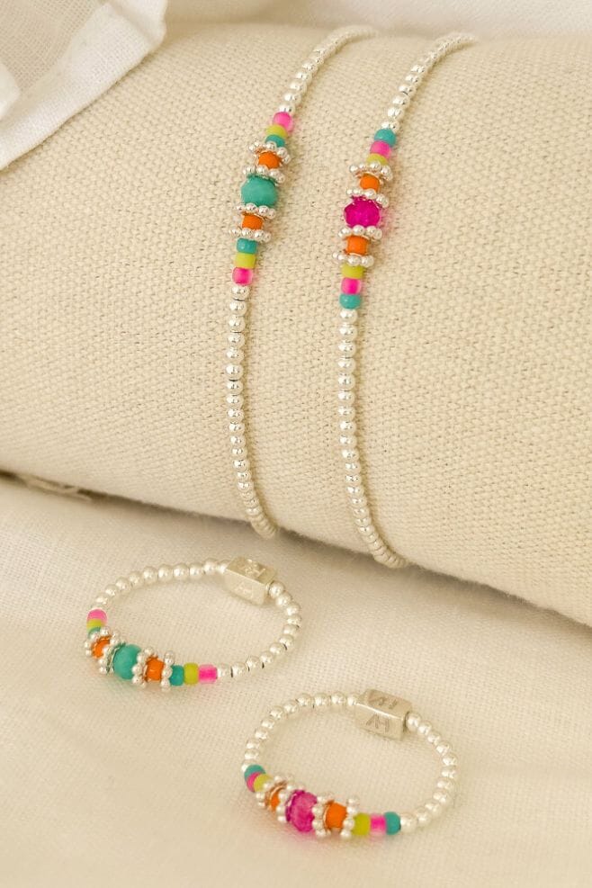 A summer stacking bracelet and ring made with 925 Sterling Silver and colourful Miyuki beads.