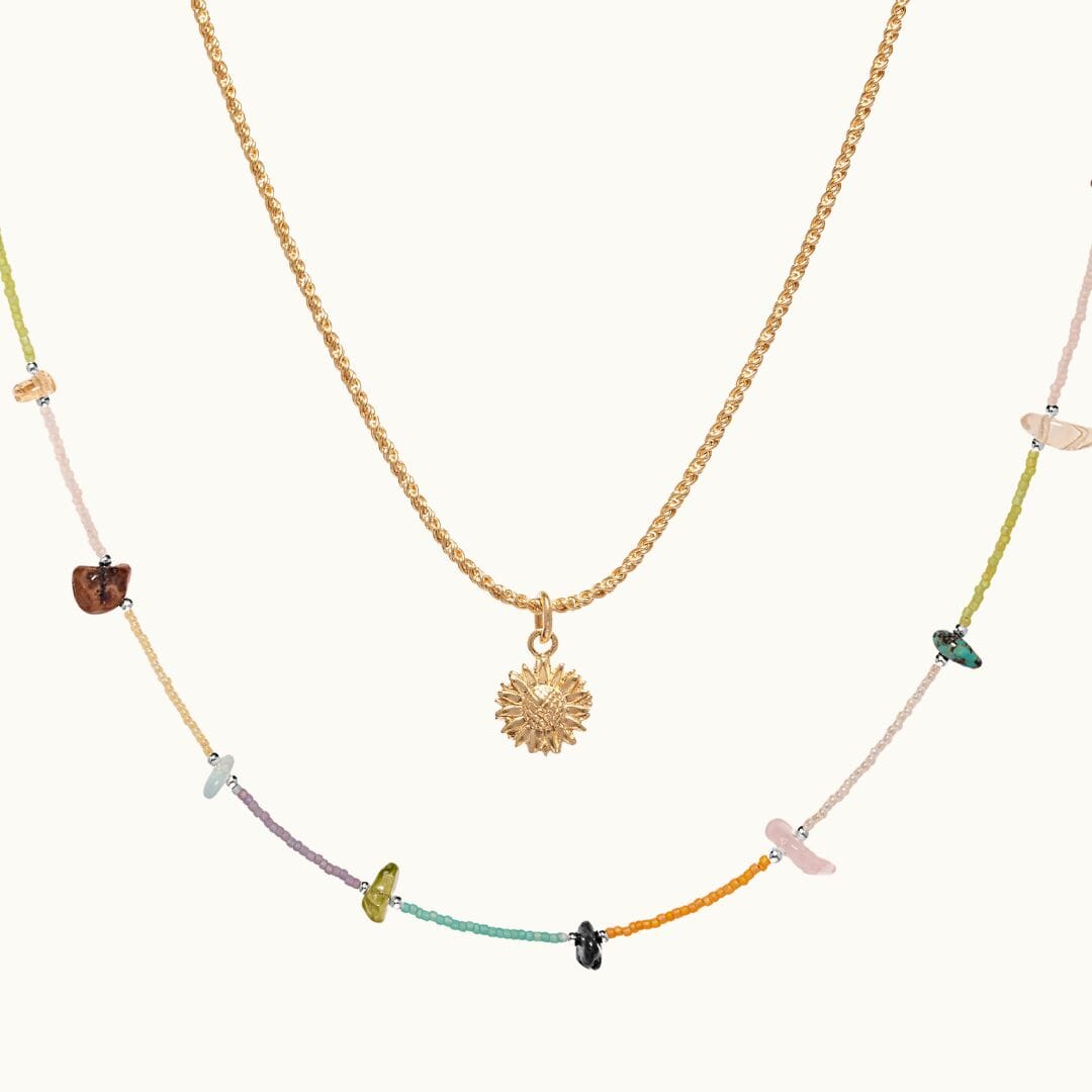 Pairing our colourful Rainbow necklace, featuring semi-precious stones, and our Sunflower necklace.