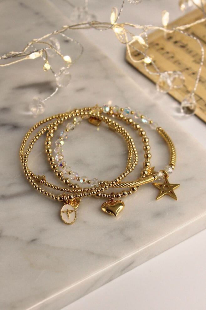 An enchanting four strand bracelet stack, featuring the new Silhouette Angel Charm and sparkling Preciosa Crystals.