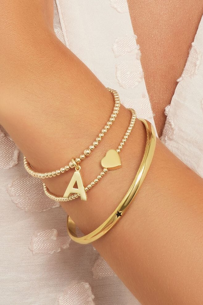 A sophisticated gold plated Sterling Silver bangle with an engraving of your choice.