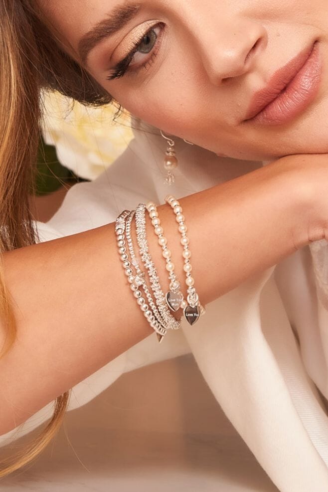 A bracelet featuring Freshwater pearls, 925 Sterling Silver, and 'Love you Mum’ charm. 