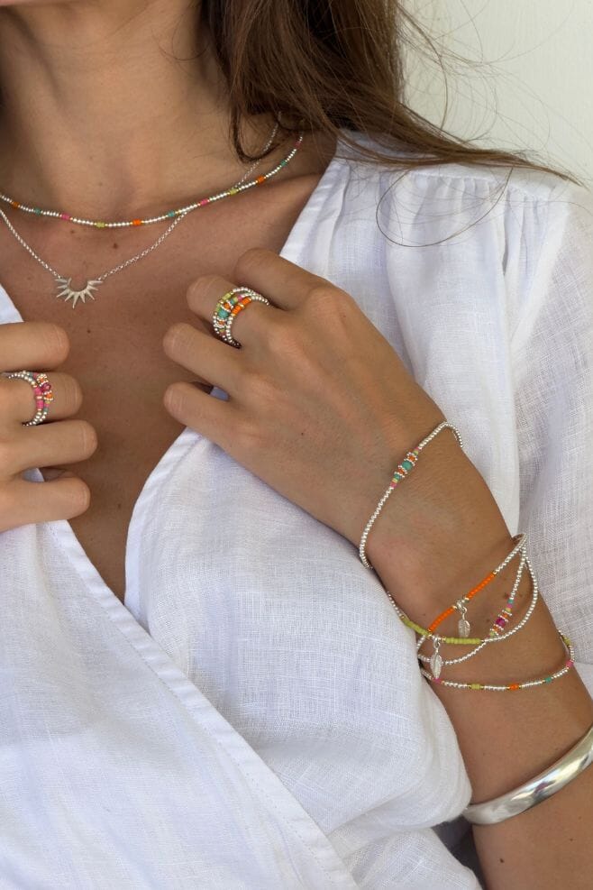 Stack up on colourful neon jewellery for summer.