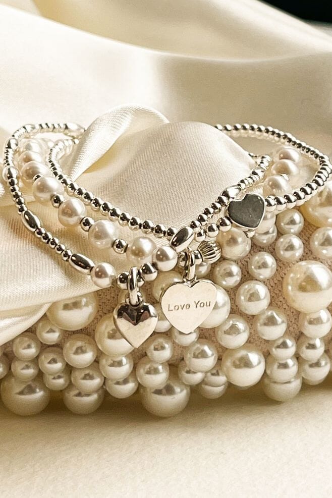Three strand bracelet stack featuring Grade AA Freshwater Pearls and 925 Sterling Silver beads.