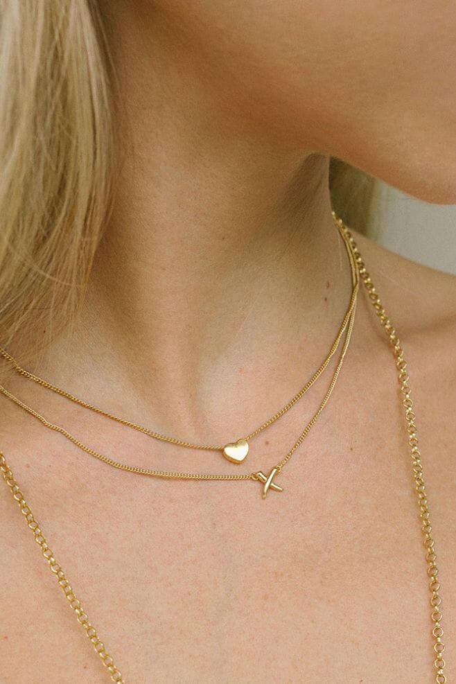 This delicate necklace is crafted in Gold plated Silver and features an engraved ‘Love You’ on a signature ANNIE HAAK Heart.