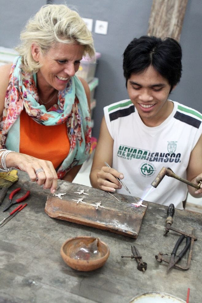 Annie working with silversmiths in Bali.