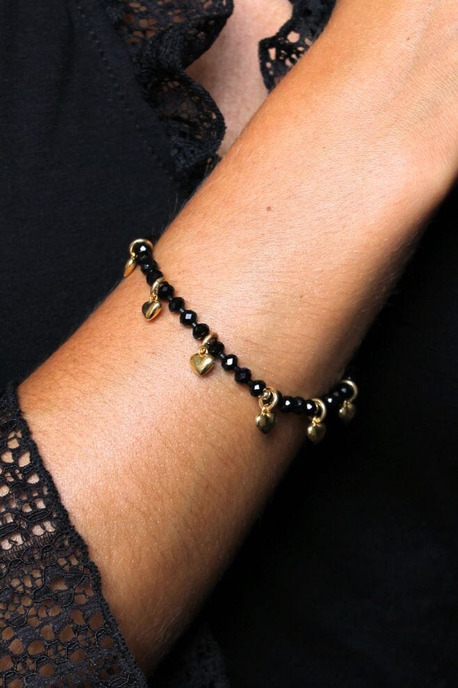 The Lady in Black Crystal Bracelets - Solid Hearts features eight gold plated Silver heart charms from our Archive, nestled amongst black Presioca Crystals.