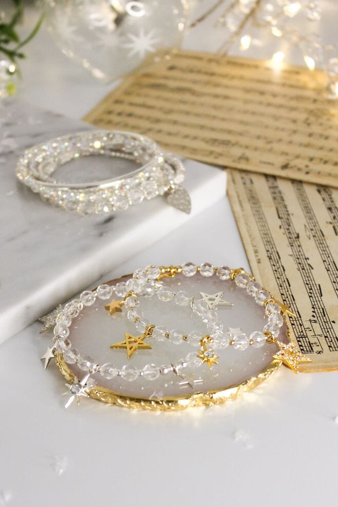 This elegant gold plated Silver bracelet is decorated with seven different Star charm designs and features Rock Crystal for that extra sparkle.