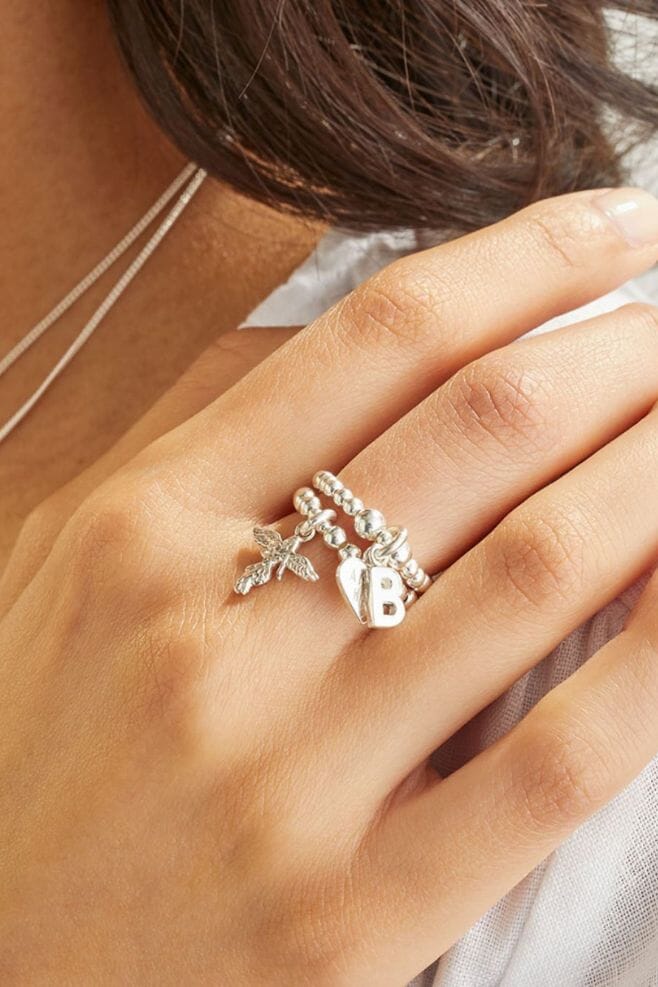 A stunning duo of beaded rings, combining two of our classics, featuring an initial charm.