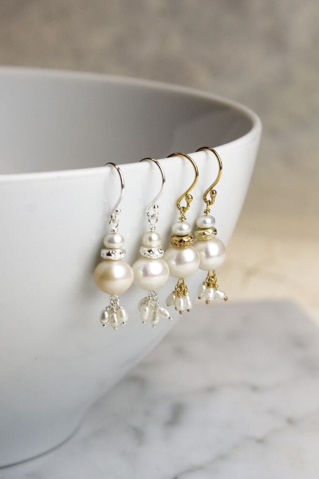 Gold plated Silver earrings featuring an array of dangling Freshwater Pearls.