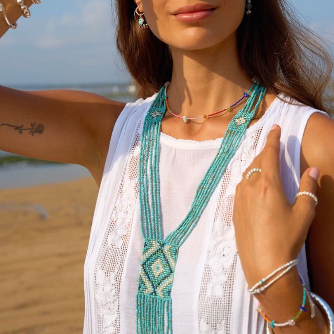 A vibrant new design with traditional Balinese beaded detailing, in turquoise.