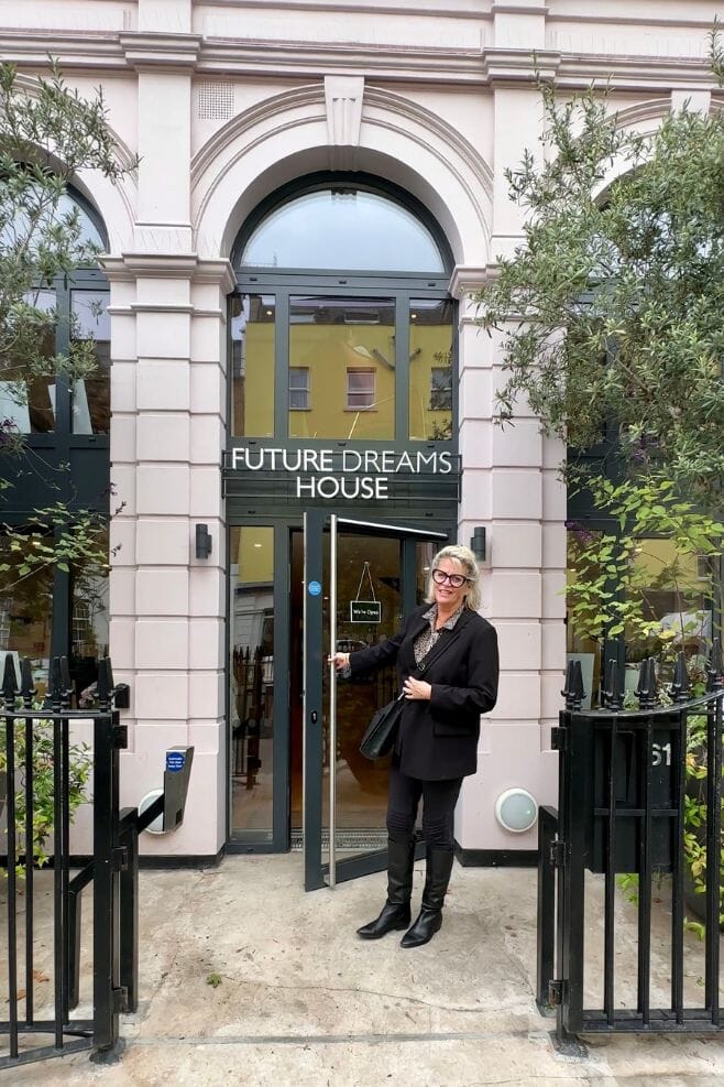 Annie opening the door to Future Dreams House in London.