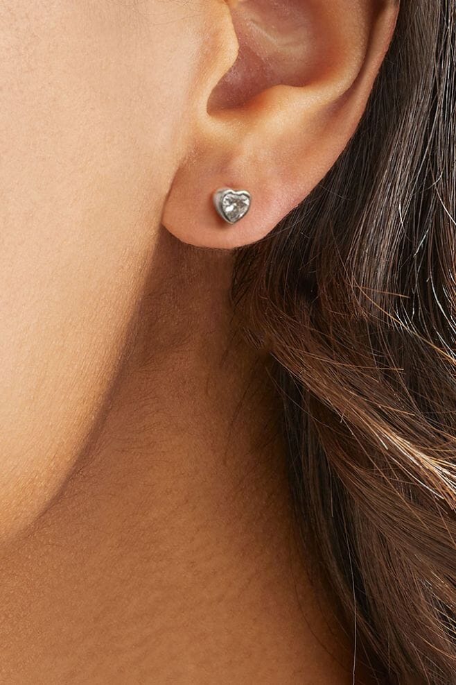 A heart shaped stud earring featuring sparkling Zirconia crystal encased in 925 Sterling Silver.