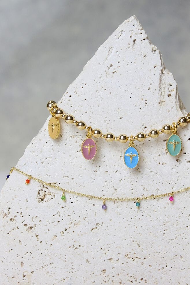 Embrace the divine with our Iridescent Angel Charm Bracelet – a true testament to eternal protection, crafted with Italian Enamel charms and gold-plated silver.