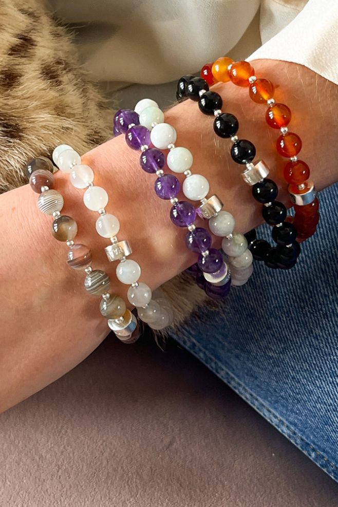Hand-threaded bracelets featuring genuine gemstone and 925 Sterling Silver beads.