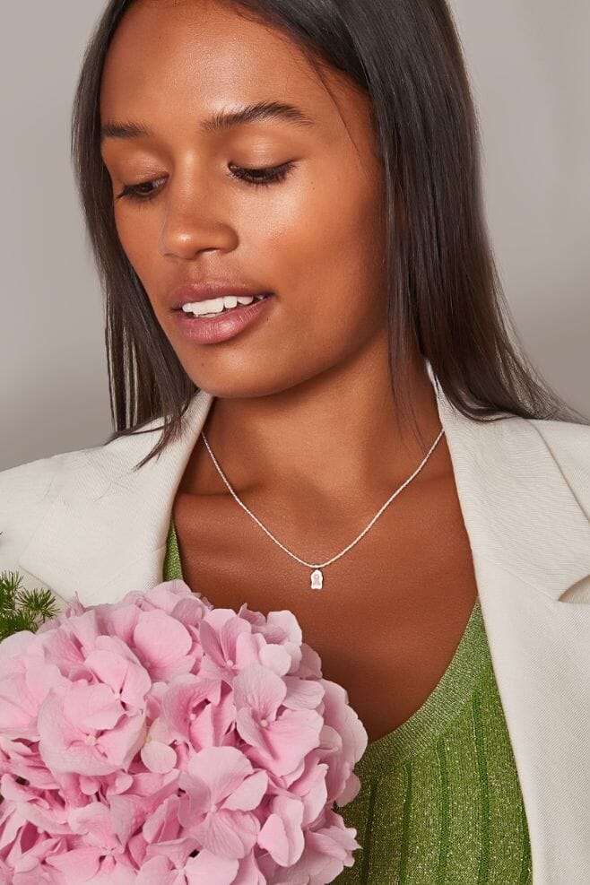 Handcrafted in 925 Sterling Silver, this necklace features a Pink Ribbon breast cancer awareness charm.