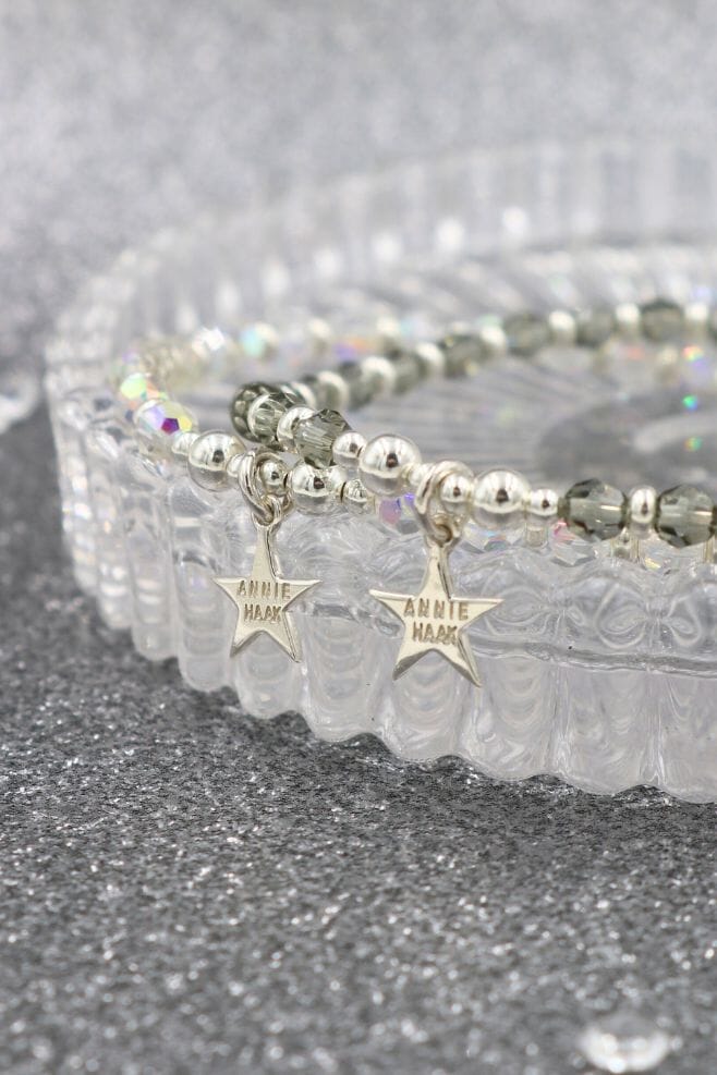 An engravable stacking bracelet featuring iridescent Preciosa crystals and 925 Sterling Silver.