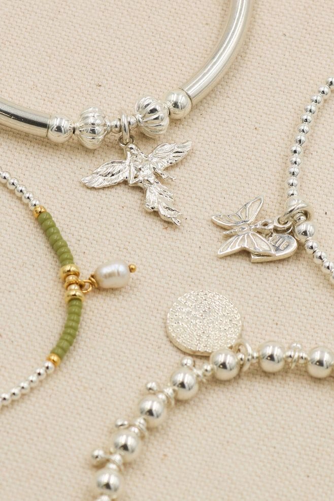 925 Sterling Silver beaded stacking charm bracelets featuring unique and meaningful charms.