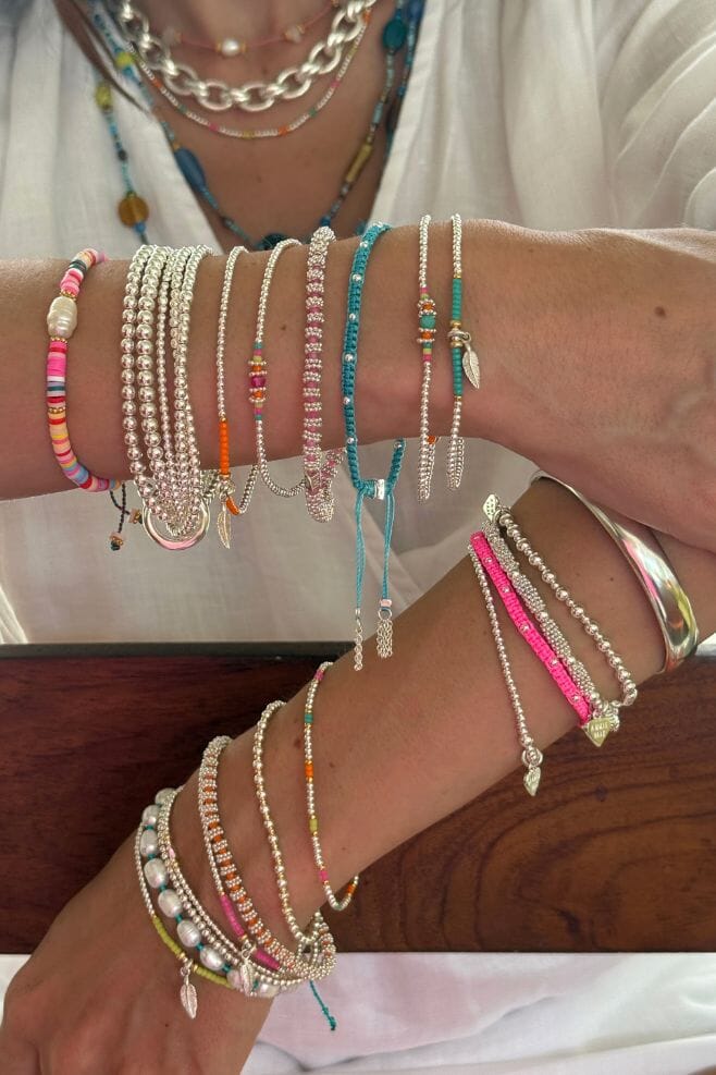 Stack up on colourful neon bracelets for summer.