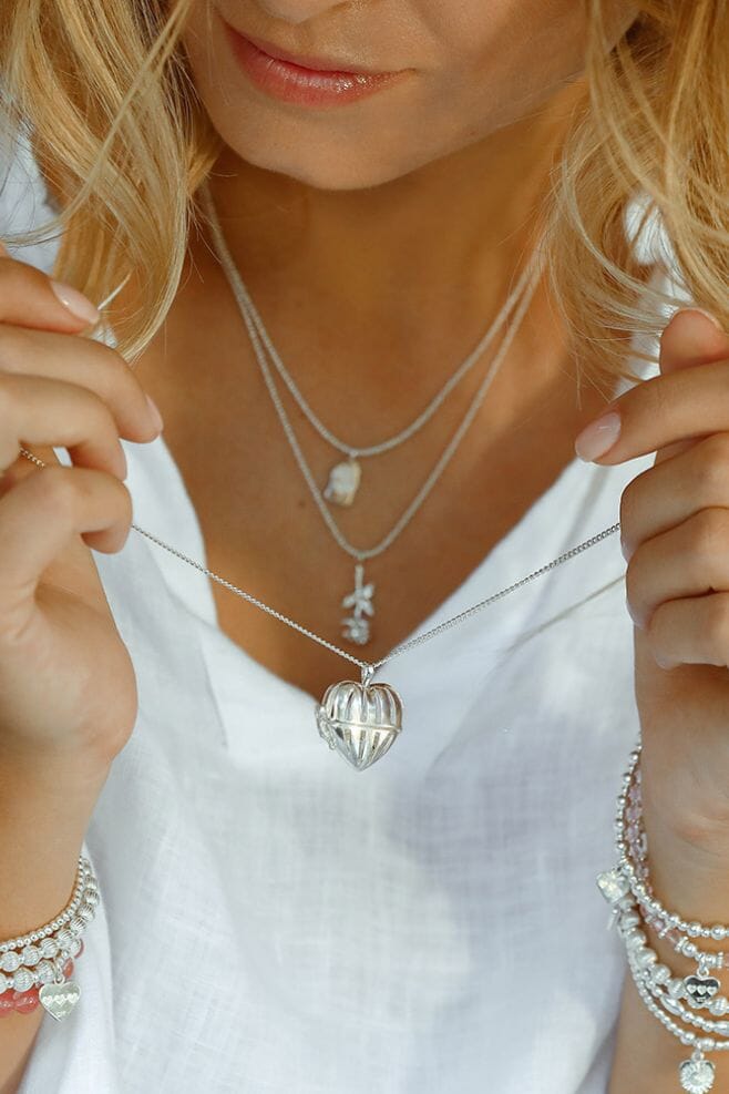 A unique 925 Sterling Silver Necklace with a Rose Stem flower charm. 
