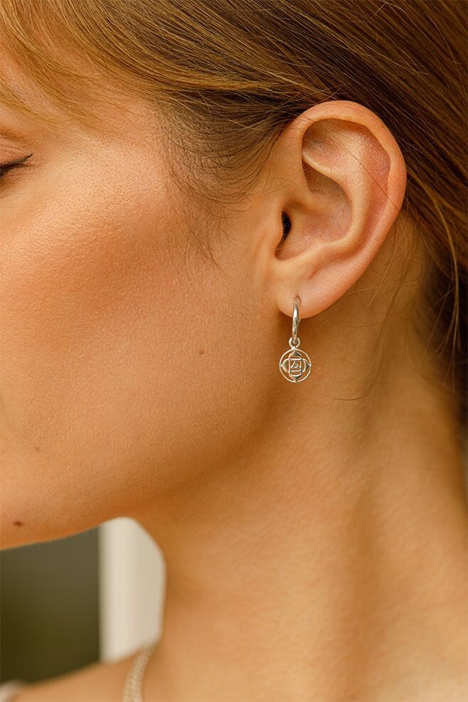These striking earrings feature a meaningful Root Chakra symbol detail, crafted in 925 Sterling Silver.
