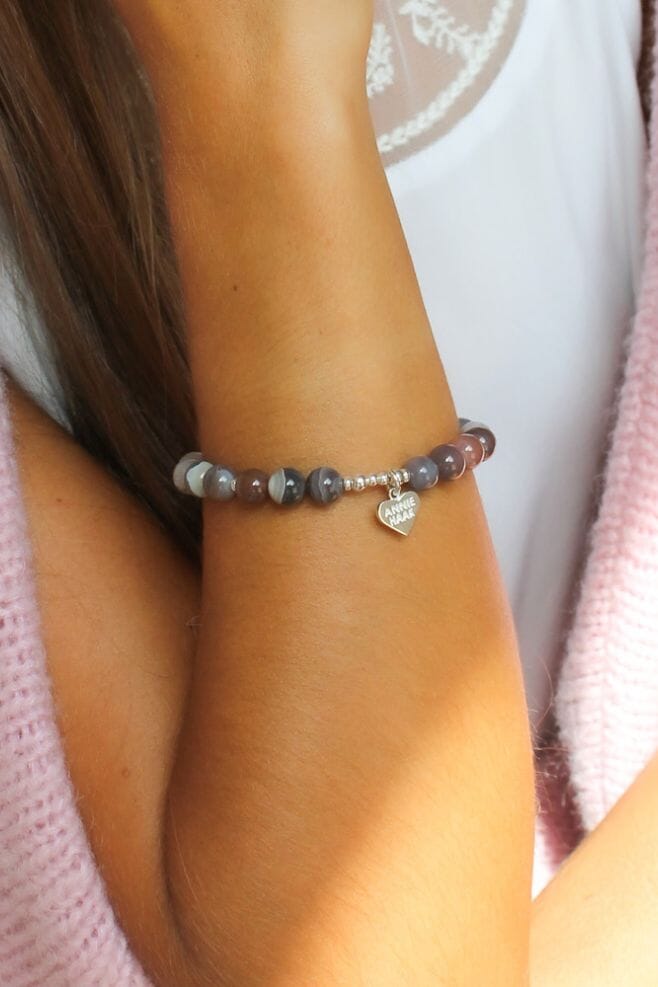 This stunning stackable bracelet features genuine Botswana Agate gemstone beads. Botswana Agate is a stone that provides comfort.