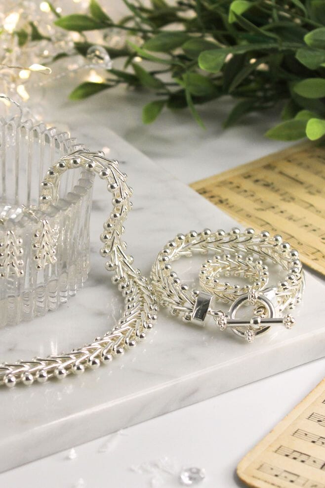 A 925 Sterling Silver statement design featuring an intricately handcrafted herringbone motif.