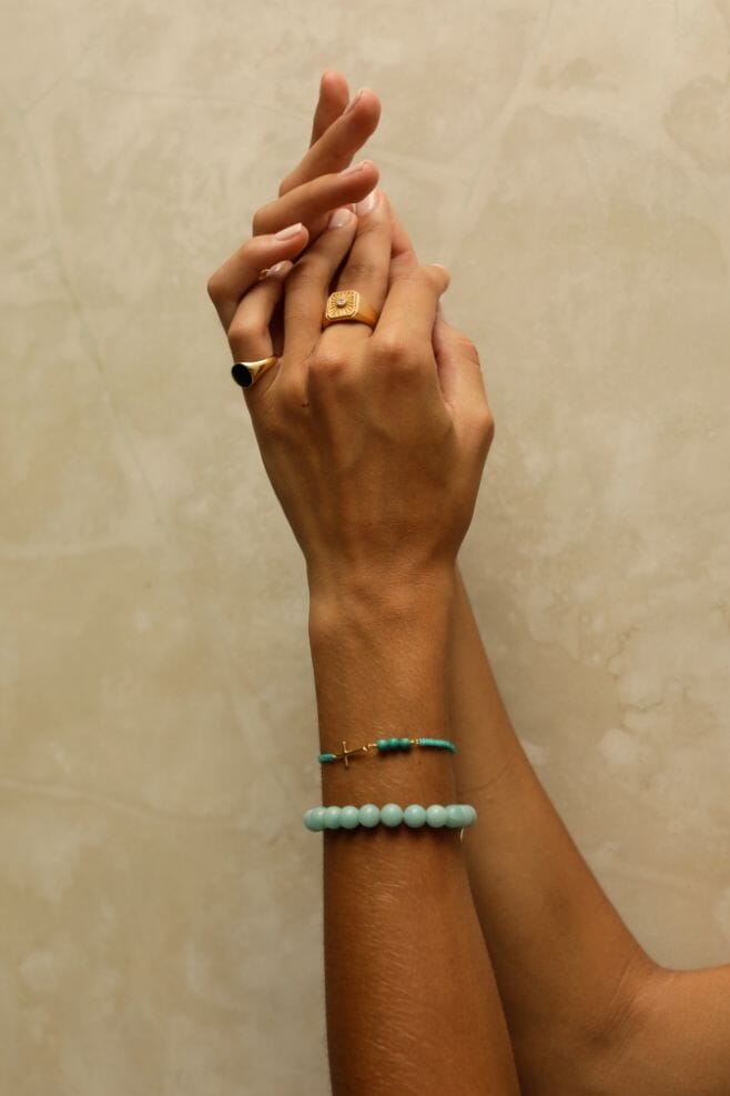 The Turquoise Cross Friendship Gold Bracelet is a fun bracelet that features a solid sideways cross charm in gold-plated 925 Sterling Silver.
