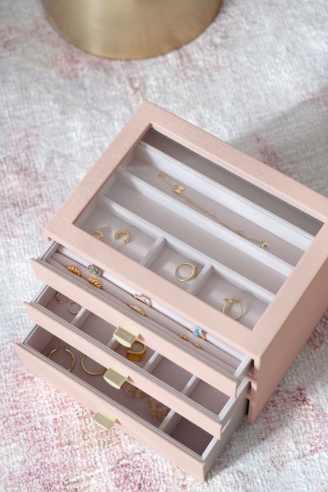 A three layer blush pink STACKERS jewellery box with transparent lid and pull out drawers.