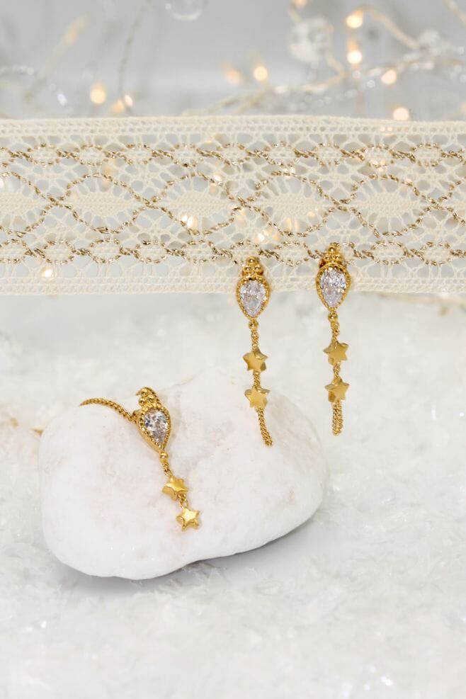 This elegant design features a Crystal Teardrop charm with dainty stars hanging gracefully.