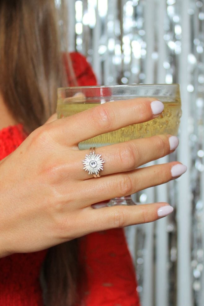 An intricately designed 925 Sterling Silver starburst detail with a sparkling crystal centrepiece.