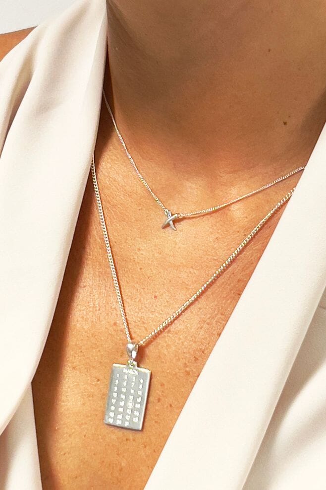 The Gala Necklace features a 925 Sterling Silver pendant engraved with the date of your choice.