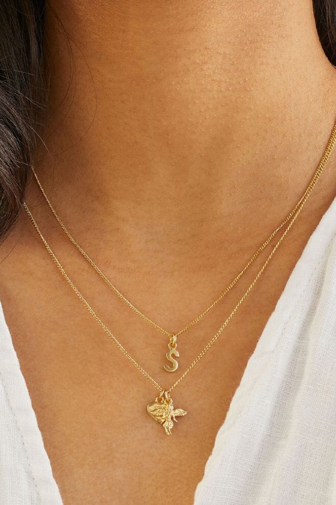 A dainty gold plated Sterling Silver necklace with a choice of cute gold Tiny Initial charms.