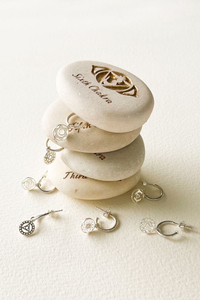 These striking 925 Sterling Silver earrings feature a meaningful Crown Chakra symbol detail.