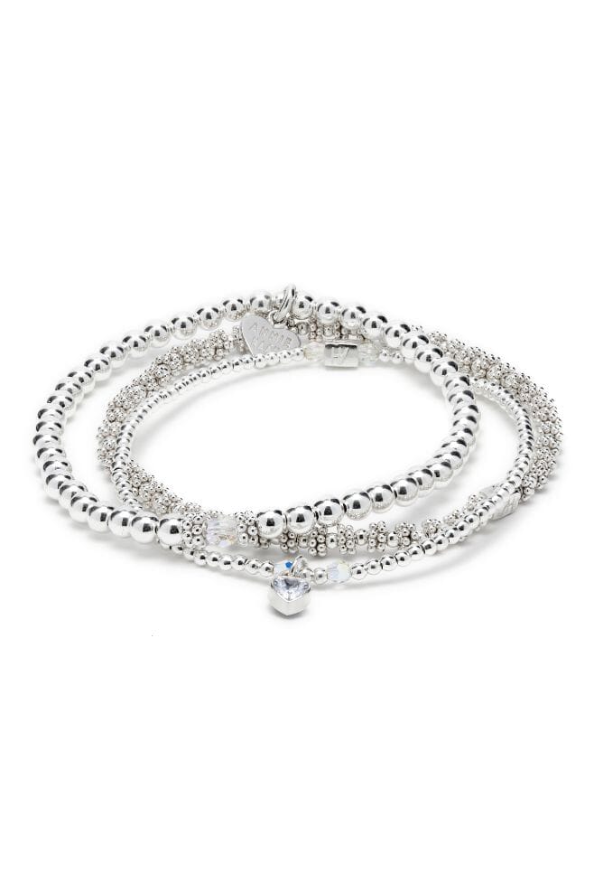 A trio of stylish and stackable Sterling Silver bracelets, featuring genuine sparkling Preciosa Crystals and a pretty Heart Crystal charm.