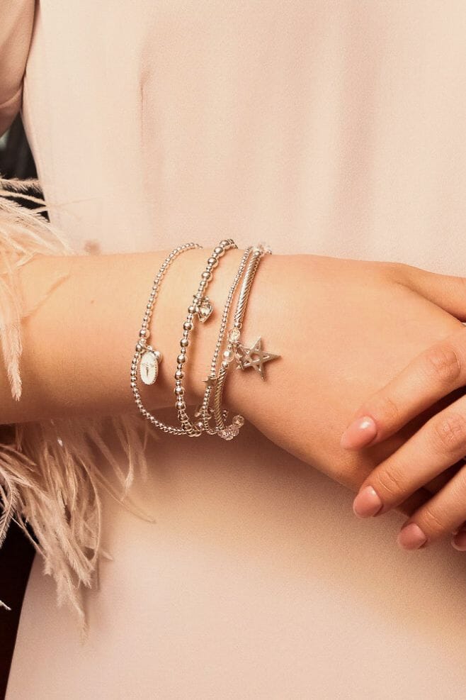 An enchanting four strand bracelet stack, featuring the new Silhouette Angel Charm and sparkling Preciosa Crystals.