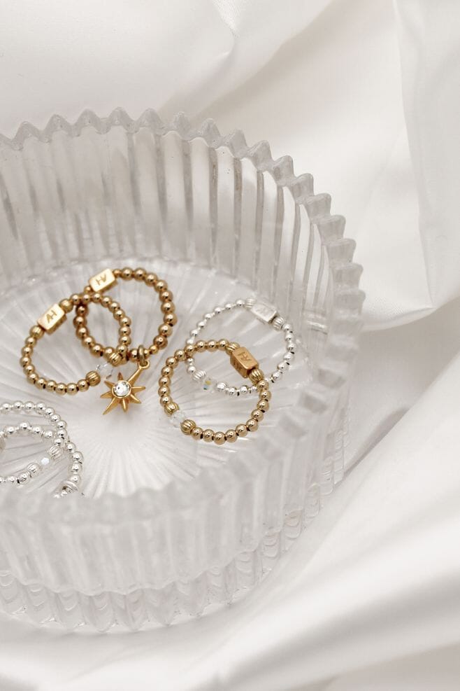 This ring stack combines two of our newest ring designs, the Aster Crystal Gold Ring and Mini Charm Astra Star Gold Ring.