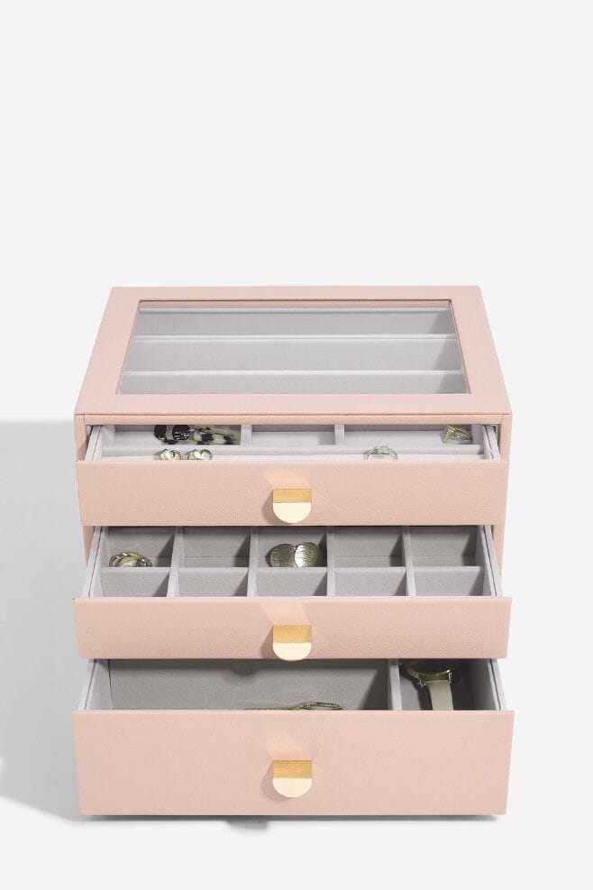 A three layer blush pink STACKERS jewellery box with transparent lid and pull out drawers.