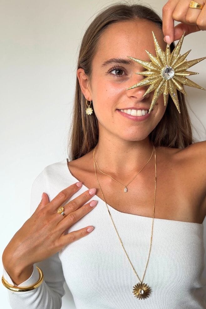 An intricately designed 925 Sterling Silver starburst detail with a sparkling crystal centrepiece.