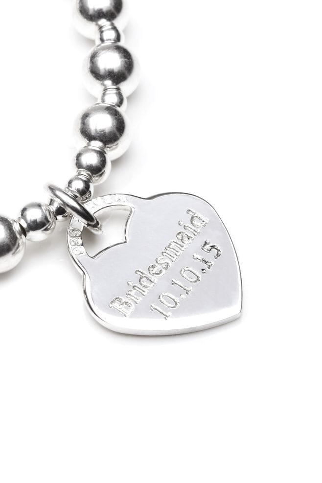 Our Orchid single strand bracelet is hand-threaded with 925 Sterling Silver beads, engraved with the message of your choice.