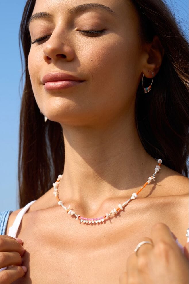 Necklace featuring Japanese beads, pearl rice beads and gold-plated silver discs.