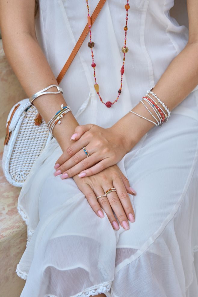 Made with 925 Sterling Silver, gold-plated Silver and Japanese seed beads, the ring is available in Terracotta, Royal Blue, Ivory and Sage Green.