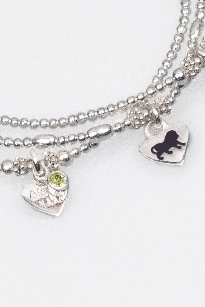 A 925 Sterling Silver two strand bracelet stack featuring the birthstone and zodiac sign of your choice!