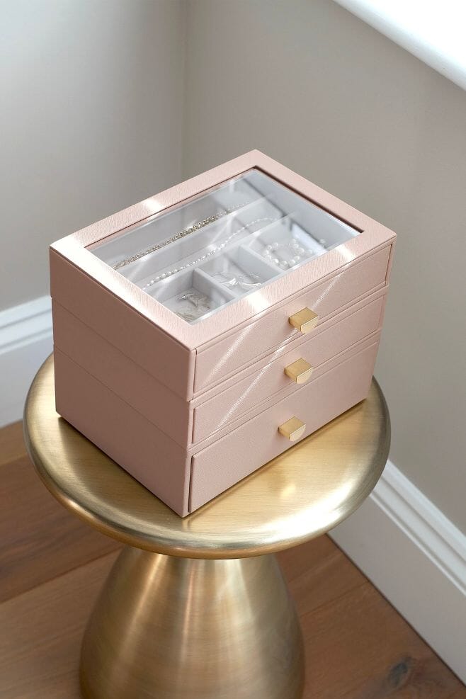 A three layer blush pink STACKERS jewellery box with transparent lid and pull out drawers.